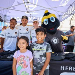 LA Galaxy players, staff and mascot Cozmo helped students in South LA get ready for the upcoming school year.
