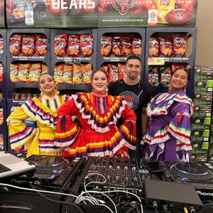 Group of people posing in store.