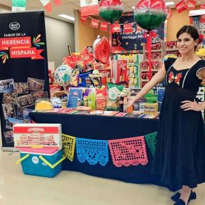 Person standing in front of booth.