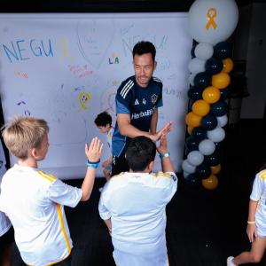 The NEGU youth and their families met the LA Galaxy players before starting the Boot Making Lab.