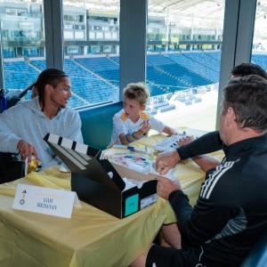 Galaxy players and coaches joined the children in decorating custom cleats.