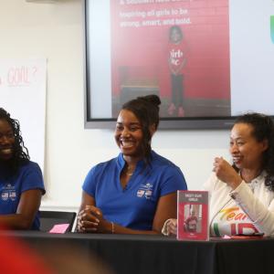 3 people sit at a table fielding questions