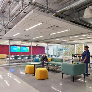 Inside of facility with chairs and lots of windows