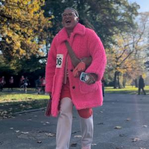 Person walking in bright pink coat
