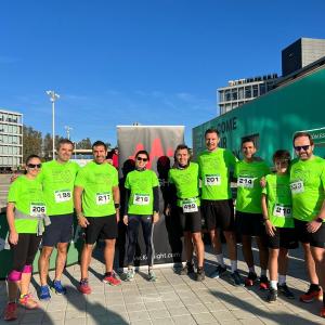Group photo of employees stood together in front of a Keysight banner