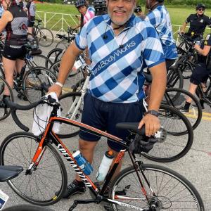 Terrance Hudson, Senior Manager of Store Optimization, stood with a bicycle