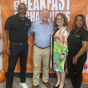 People standing together between cereal boxes on shelves