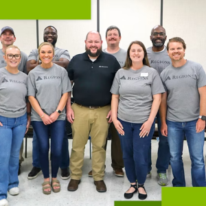 A group of people standing together in Regions Bank t-shirts