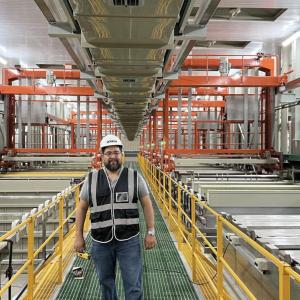 Person standing in a manufacturing plant
