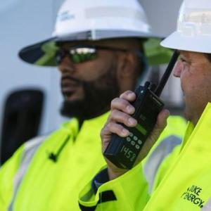 People in hard hats and reflective jackets