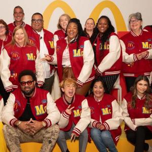 Group together wearing McDonald's letter jackets