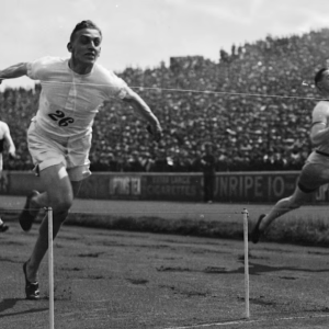 People finishing a running race in 1924