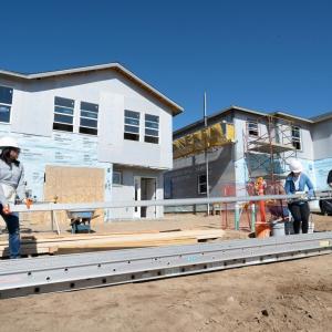 People working on house construction