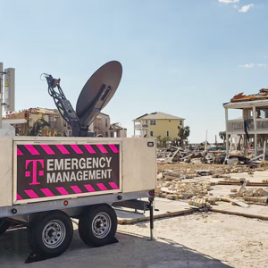 Equipment next to a damaged house