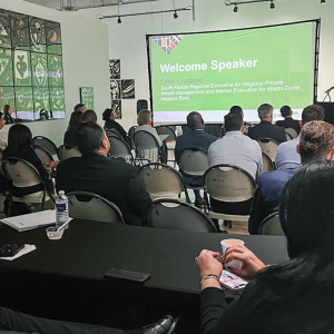 Seated people listening to a speaker