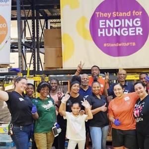 A group of volunteers posing for a photo