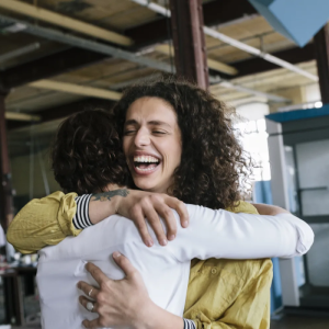 Two people embracing and smiling