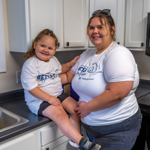 Adult and child in a kitchen