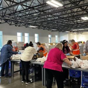 People packaging food into bags
