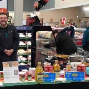 People posing at an italian food booth