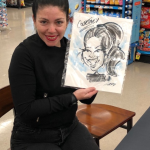 Someone posing with their caricature