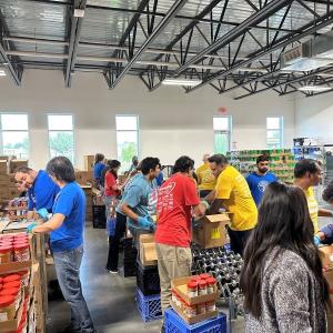Albertsons associates packing up food boxes at North Texas Food Bank for donations.