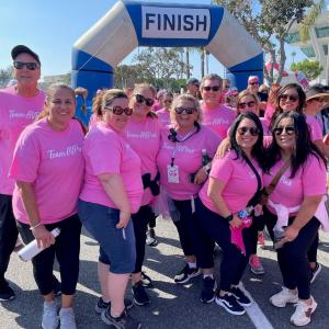People pose at the finish line of the Orange County, CA Susan G. Komen More than Pink Walk.