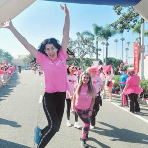 People pose at the finish line of the Orange County, CA Susan G. Komen More than Pink Walk.
