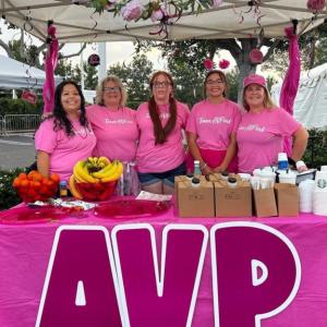 People pose at the AVP booth at the Orange County, CA Susan G. Komen More than Pink Walk.
