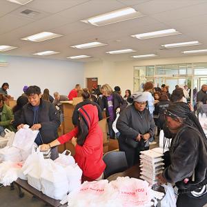 People picking up meals at the food distribution service
