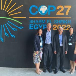 group photo in front of COP27 sign