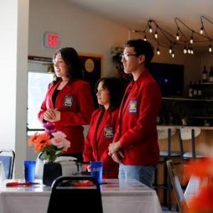 A group of people standing in a room