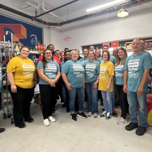 Group posing for a picture in food pantry