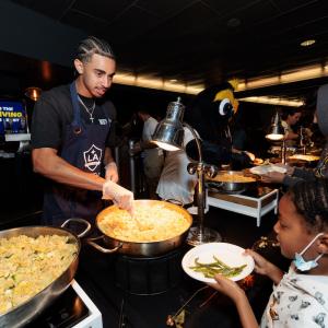LA Galaxy defender Jalen Neal helps serve families in need at the 20th annual Thanksgiving Foundations’ Feast.