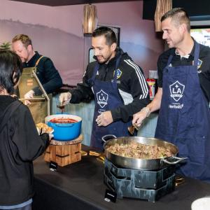 Urel Martinez, LA Galaxy's Chief Revenue Officer, and Thomas Braun, LA Galaxy's President and Chief Operating Officer, helped served Thanksgiving dinners to guests.
