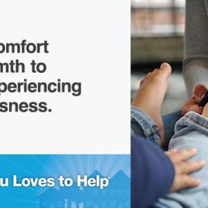 parent putting a child's sock on