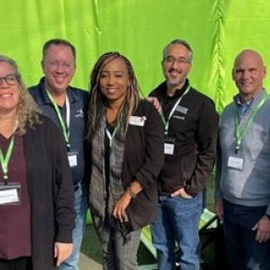 Group of people posing for picture