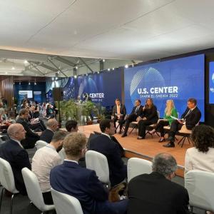 5 speakers on sitting on stage