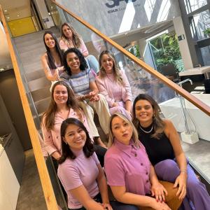 Group of women sitting on staircase