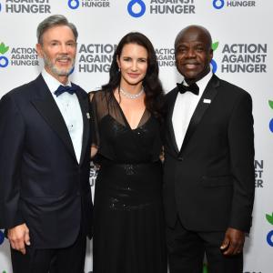Raymond Debbane, Kristin Davis and Dr. Charles Owubah pose for a photo.