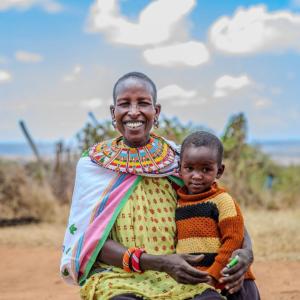 Nakiruni and Enza smile for a photo. 