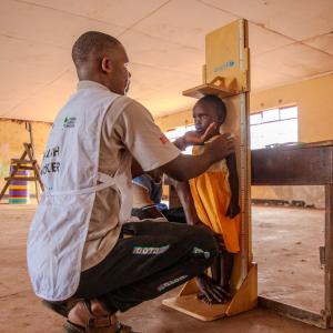 Rashei's height is checked at the Action Against Hunger clinic. 