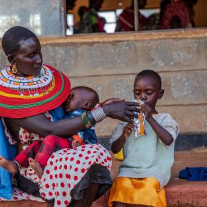 Rashei is fed RUTF by his mother at the Action Against Hunger clinic. 