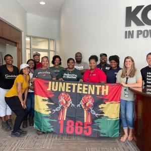 group with Juneteeth flag