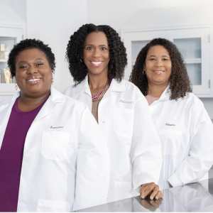 Three people in lab coats