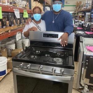 two people with a stove