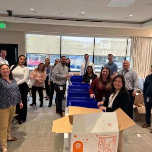 A group of people packing hygiene kits