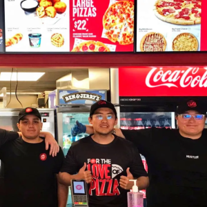 Employees standing together inside a restaurant