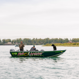 people in a boat on a river