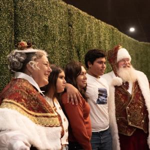 Mr and Mrs. Claus visited families at the Holly Jolly Thanksgiving Dinner.